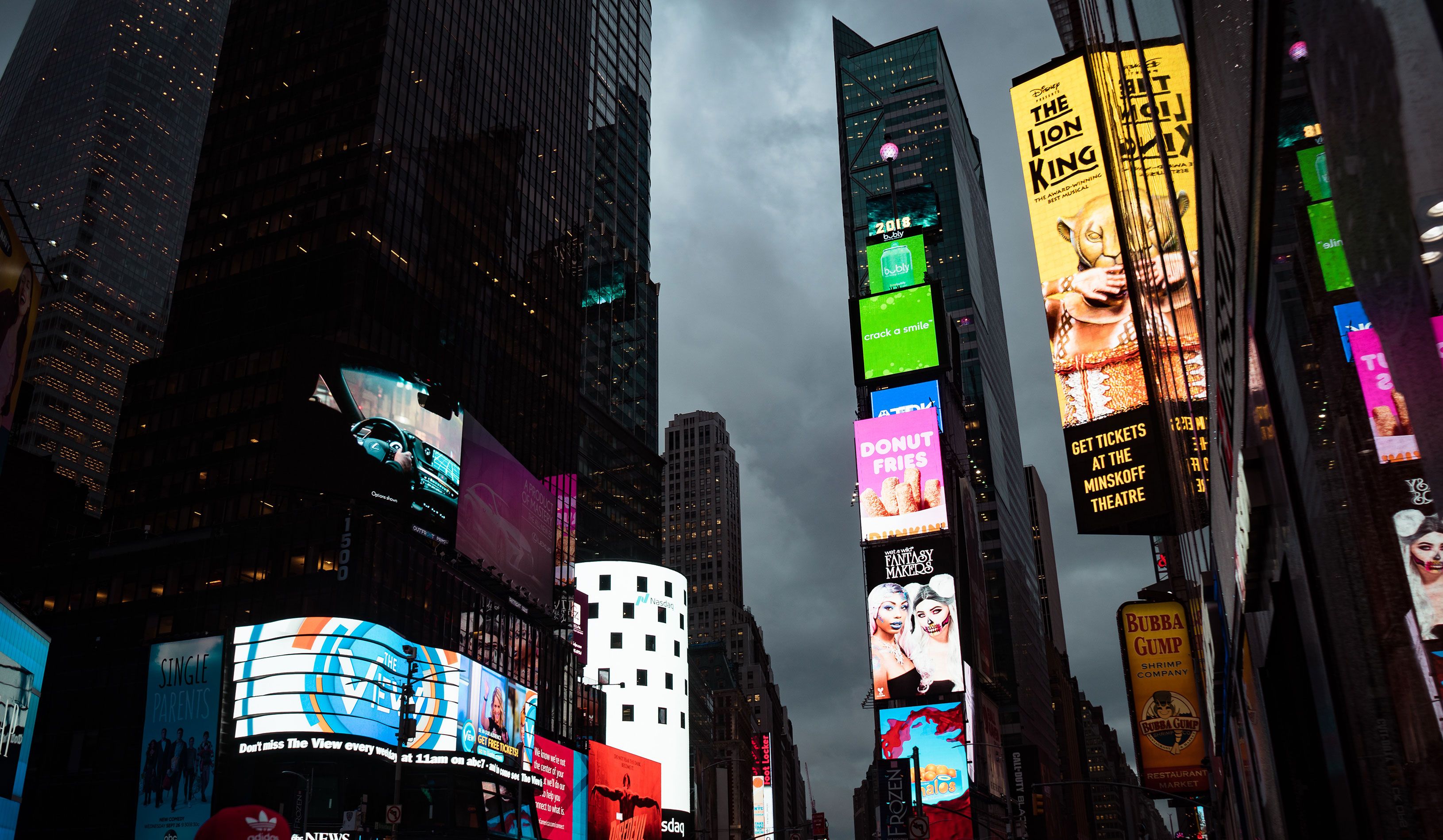 Tall New York buildings pictured with bright and colorful Digital Signage and Displays