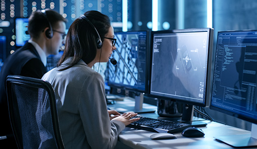 Employees communicating within Command Center / Control Room