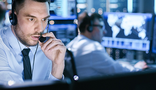 Two men focused in a Security Center